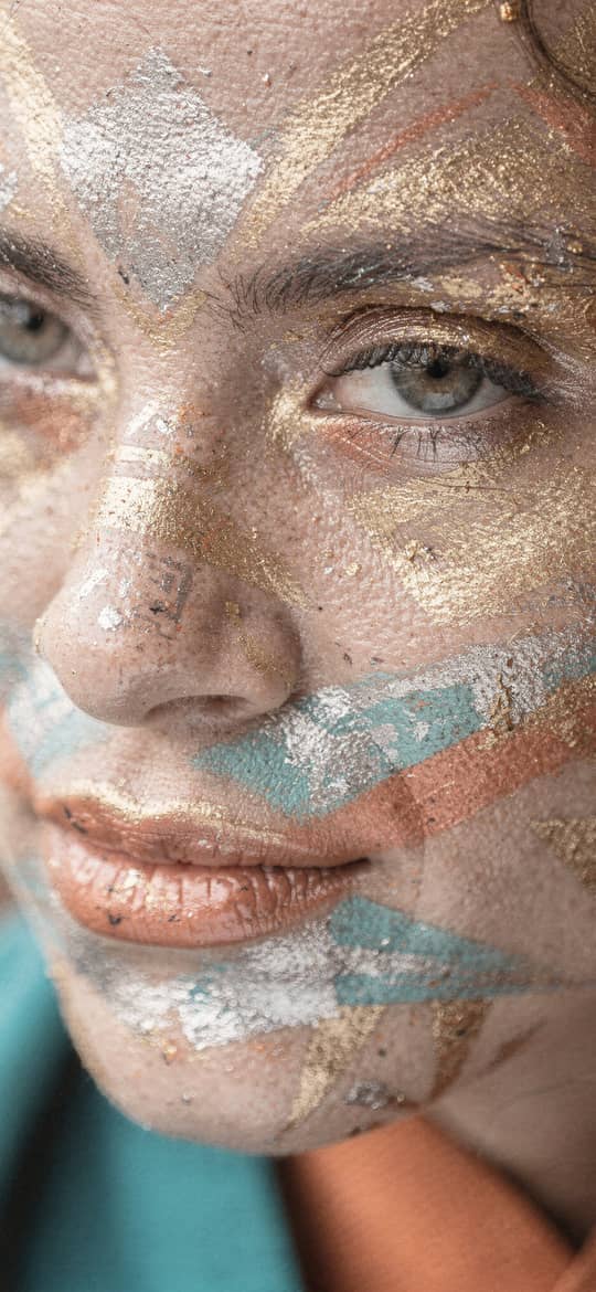Woman with Gold Teal Metallic Face Paint