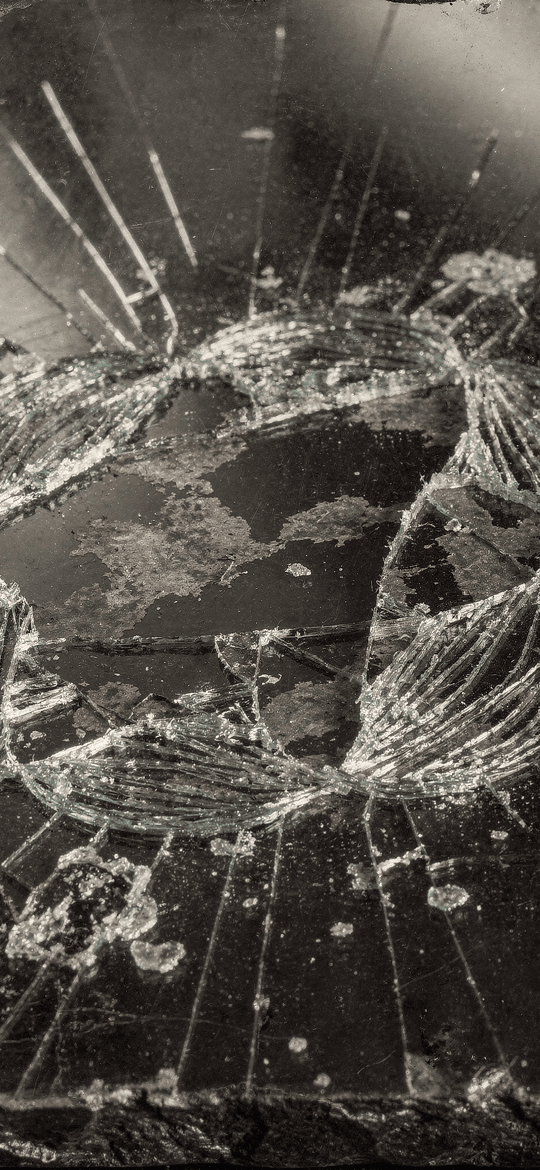 Shattered Glass Ring Around a Faded Globe