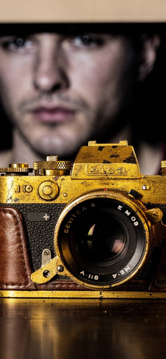 Weathered Gold Vintage Camera on Desk
