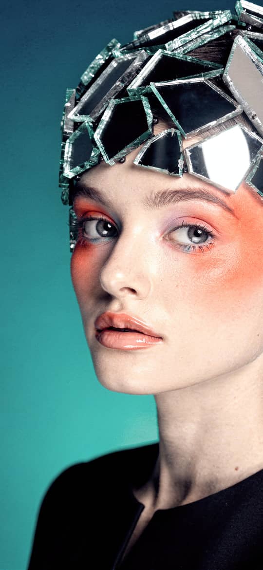 Woman Wearing Shattered Mirror Headpiece