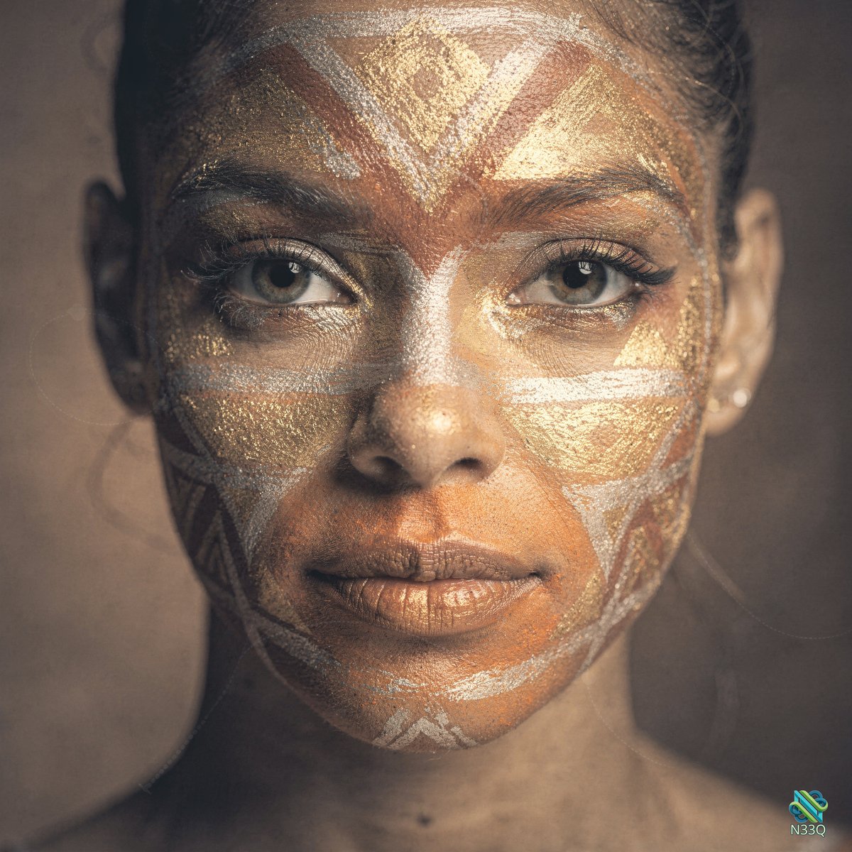 Woman with Golden Geometric Face Paint
