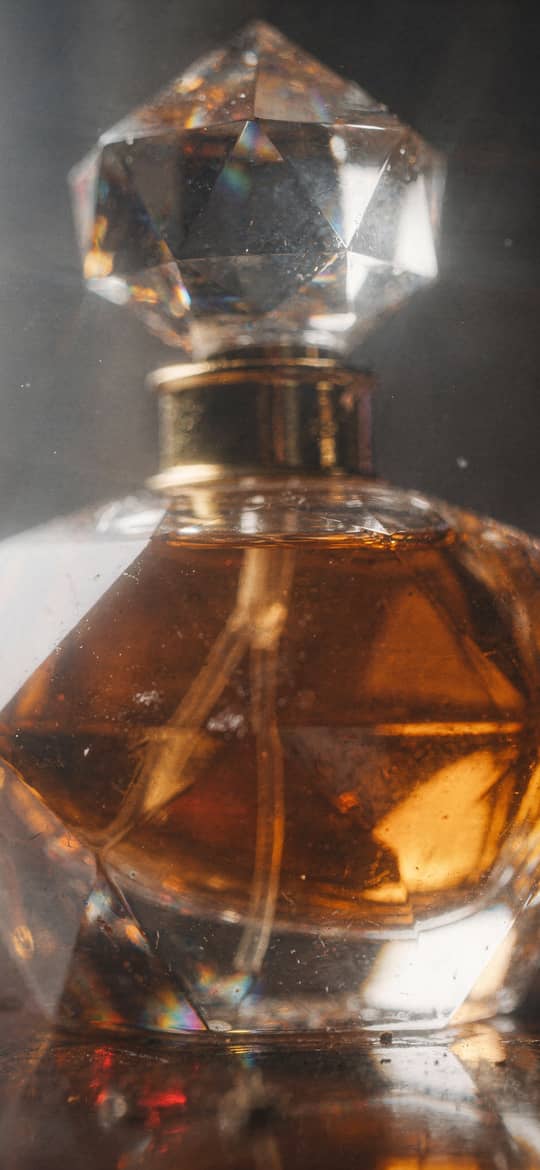 Faceted Crystal Perfume Bottle with Amber Liquid