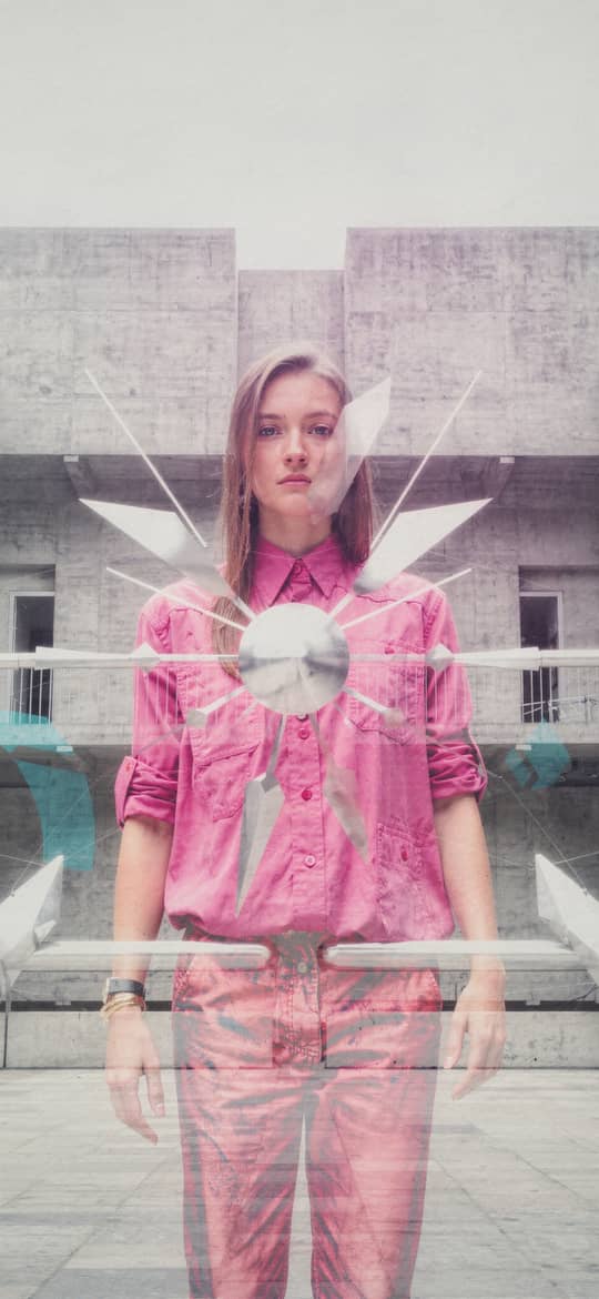 Woman in Pink in Brutalist Concrete Plaza