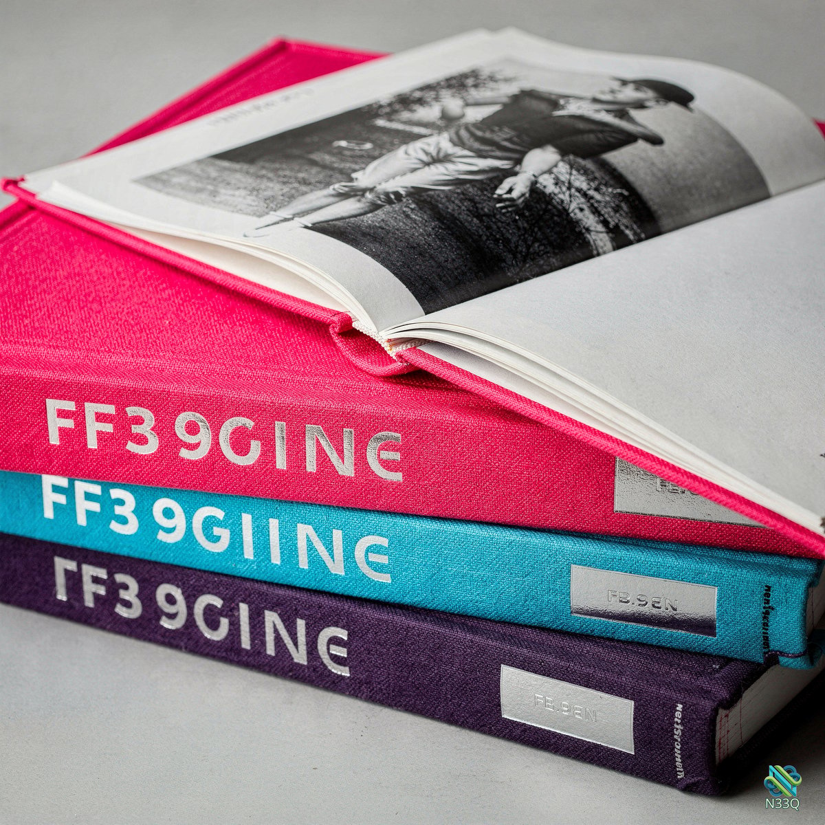 Stack of Colorful Books with Open Vintage Photo
