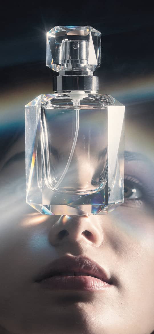 Crystal Perfume Bottle Over Woman's Eyes