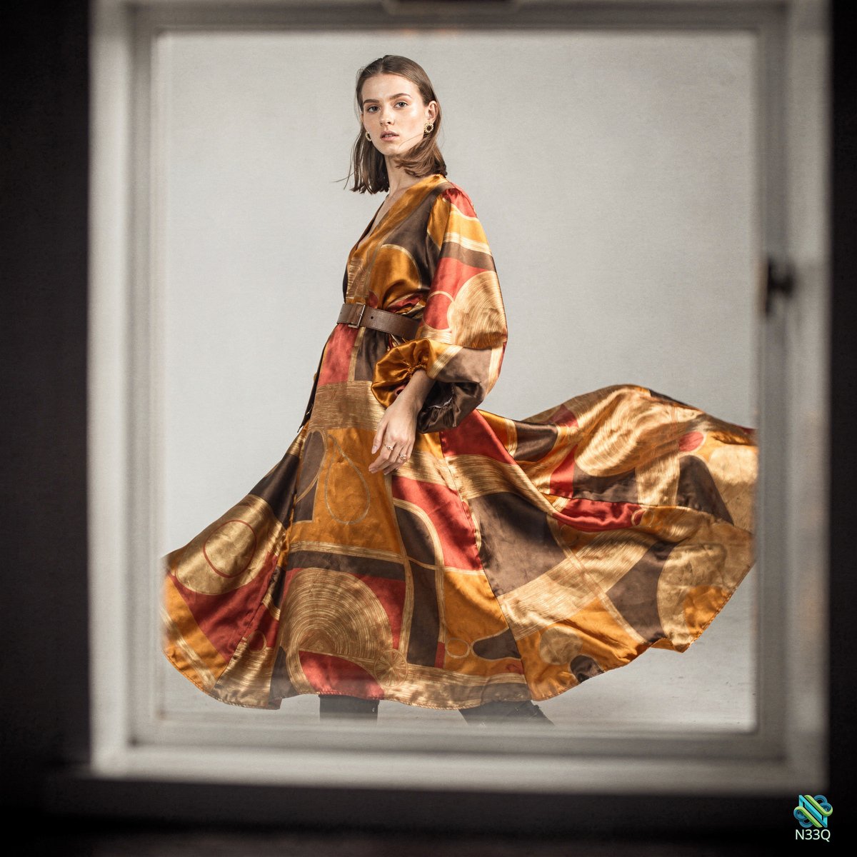 Woman in Swirling Geometric Patterned Dress